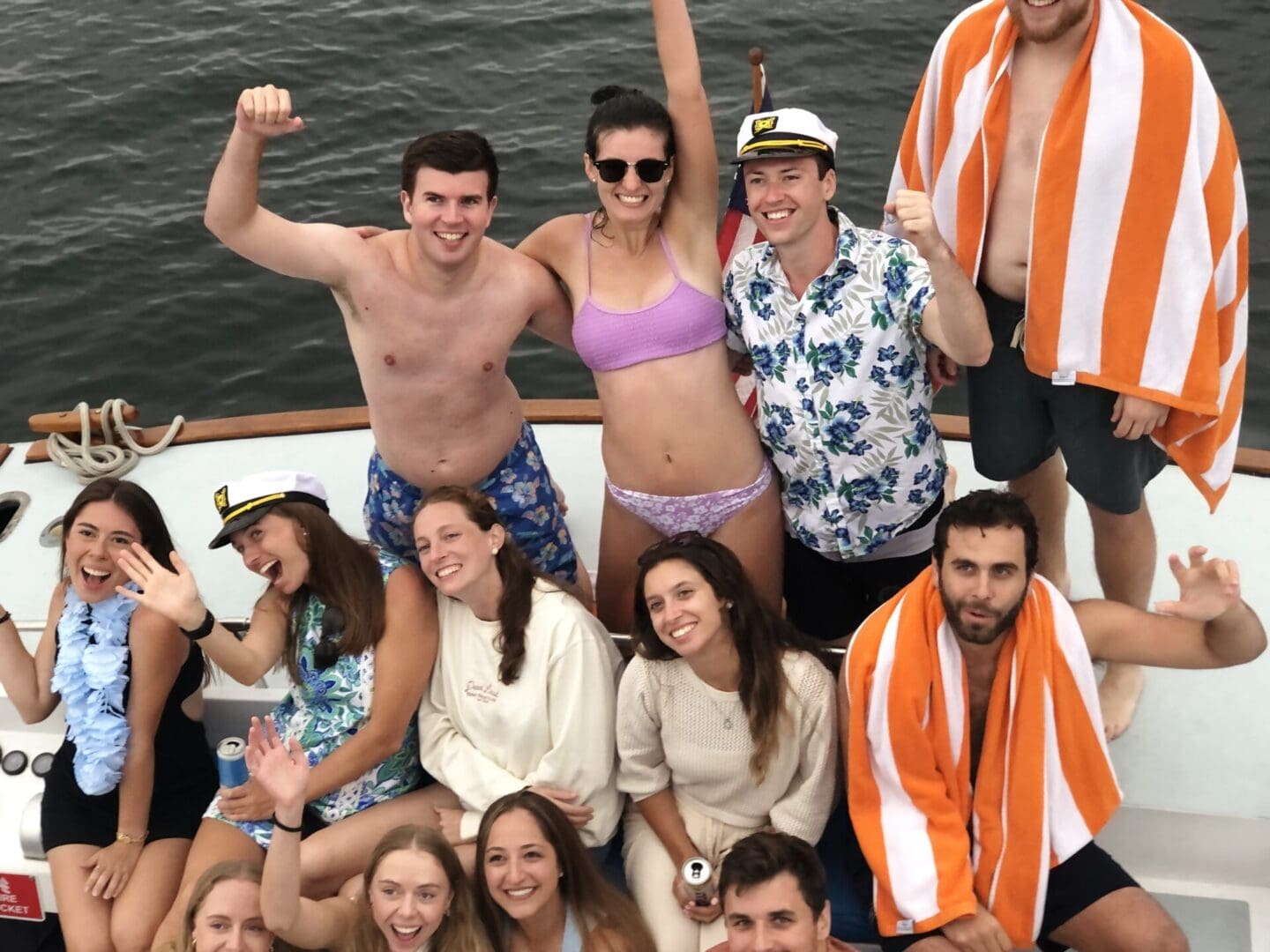 A group of people on the back of a boat.