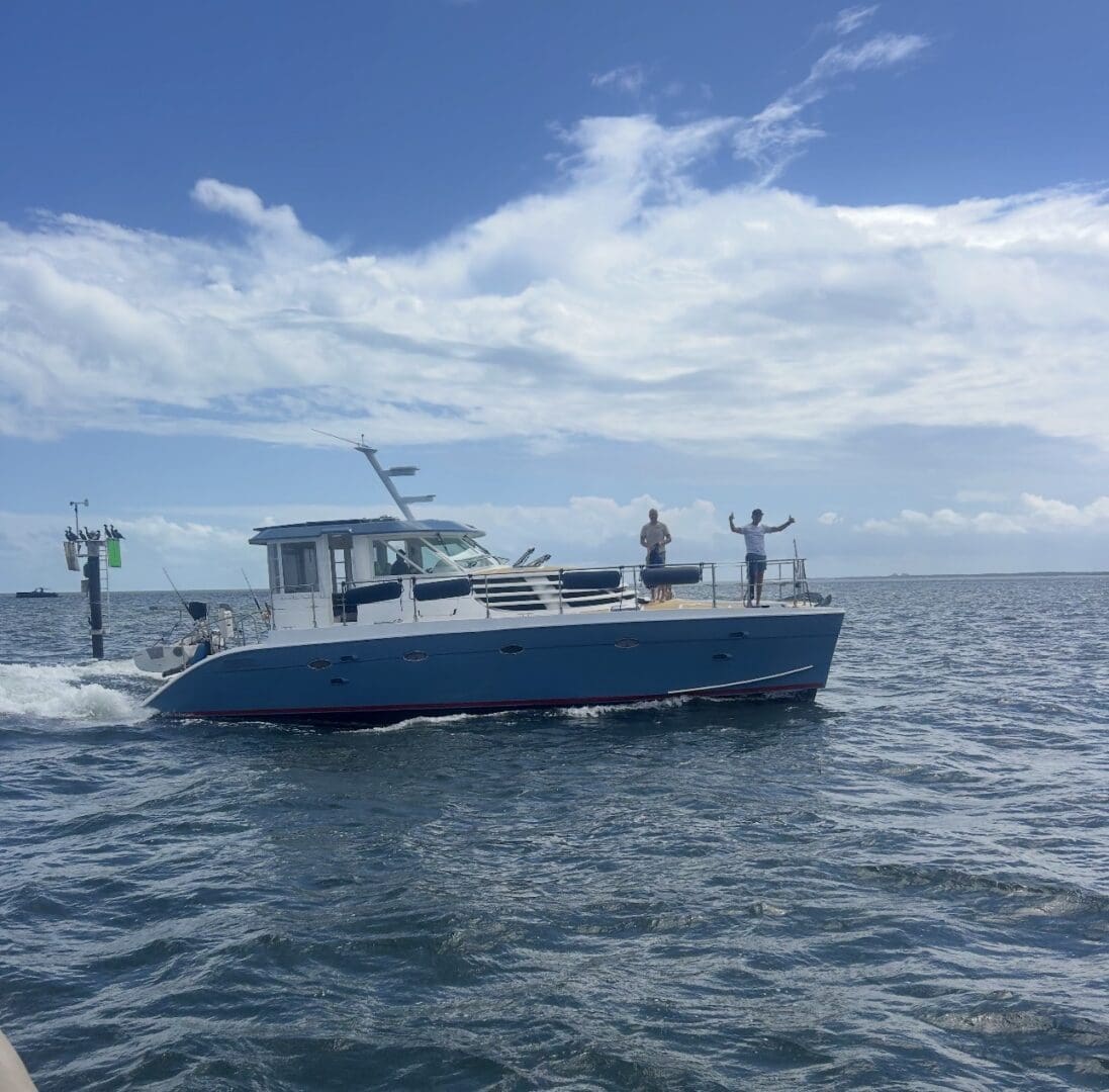 Motor yacht with two people on deck